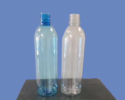 Blue and clear half liter empty bottles